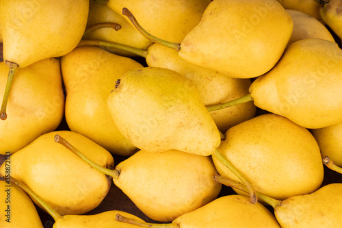 heap of fresh yellow pears background