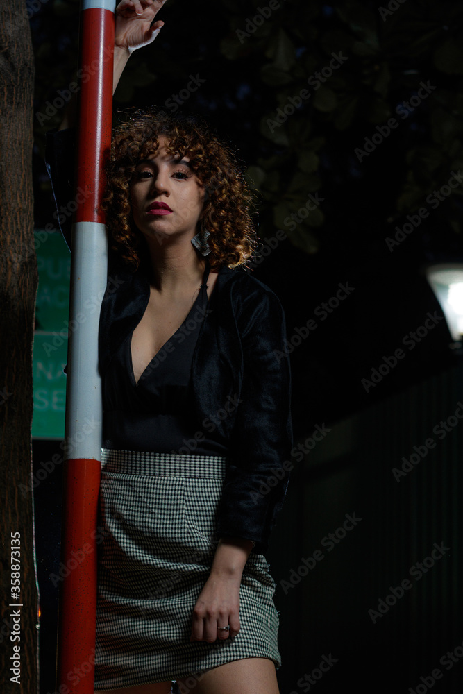Young curly brown hair girl in the square