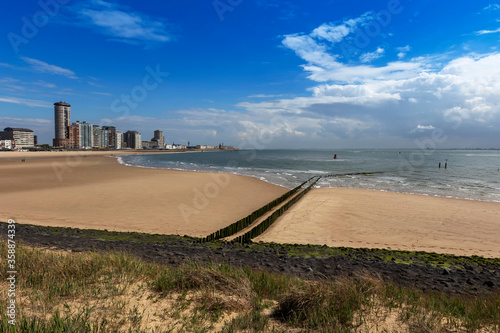 Vlissingen - a beautiful sandy bay with a wooden breakwater and a coastal promenade of standing houses  hotels and restaurants.