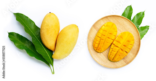 Mango with leaves on white background.