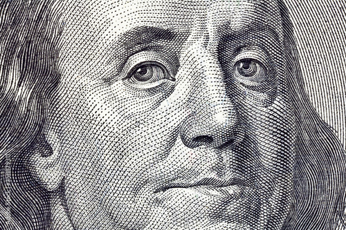 Macro close up of Ben Franklin on the US $100 dollar bill.