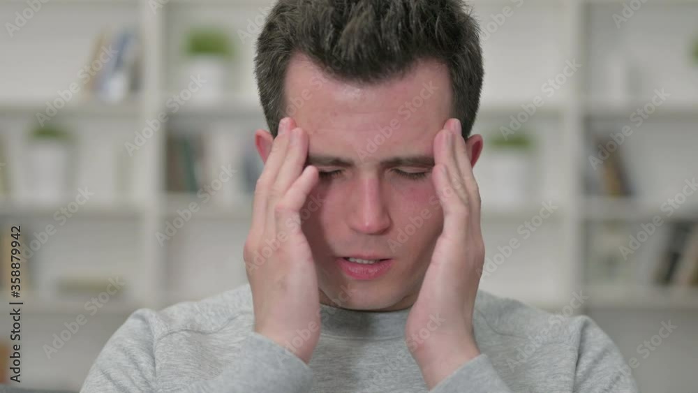 Portrait of Tired Young Male Designer having Headache Portrait of Tired Young Male Designer having Headache
