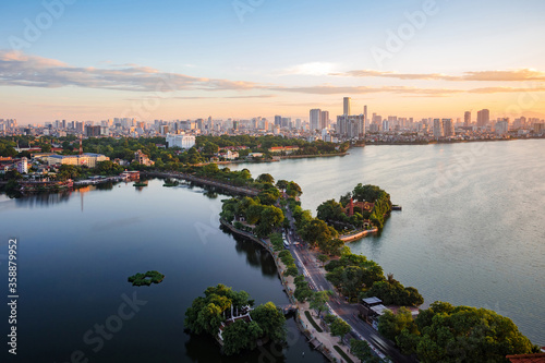 Aerial view of Hanoi skyline showing West Lake and Tay Ho District at sunset in Hanoi  Vietnam.