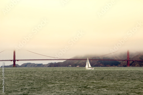 Sailboat on the Ocean, bay of San Francisco, Golden Gate Bridge background