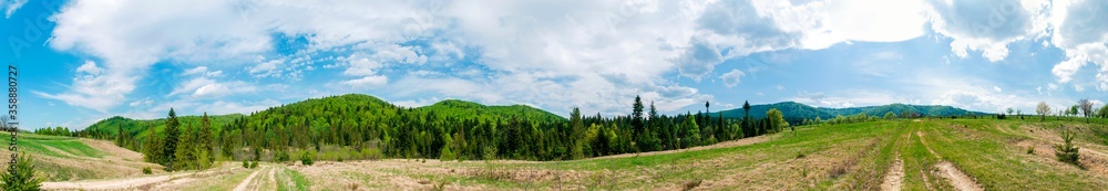 Beautiful rural summer landscape with forest, blue sky and white clouds, panorama. spring landscape with panoramic views of meadow and mountains Beautiful rural summer landscape with forest, blue sky and white clouds, panorama. spring landscape with panoramic views of meadow and mountains