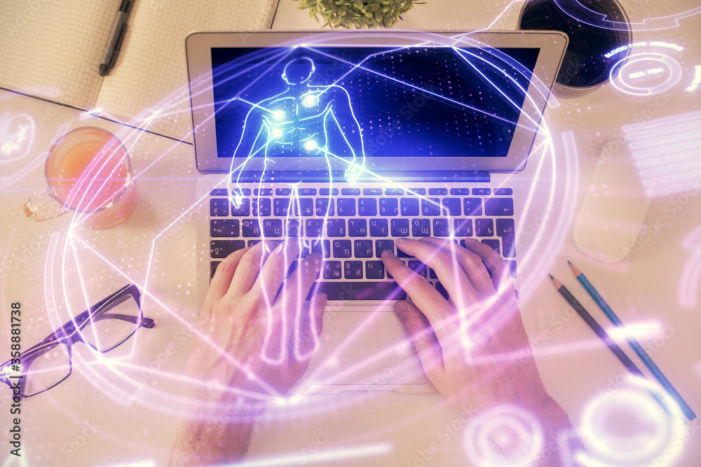 Double exposure of man's hands typing over computer keyboard and science theme hologram drawing. Top view. Education concept. Double exposure of man's hands typing over computer keyboard and science theme hologram drawing. Top view. Education concept.