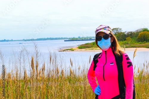 young woman wearing mask and gloves © Edymar