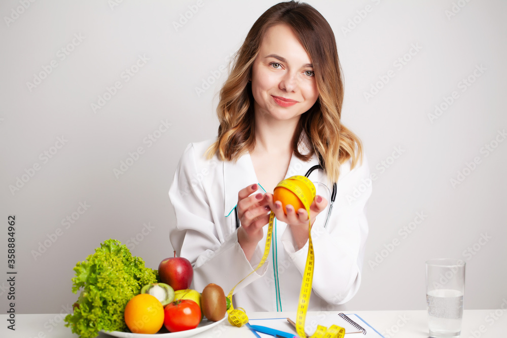 Nutritionist makes a diet plan for proper nutrition for the patient in his office Nutritionist makes a diet plan for proper nutrition for the patient in his office