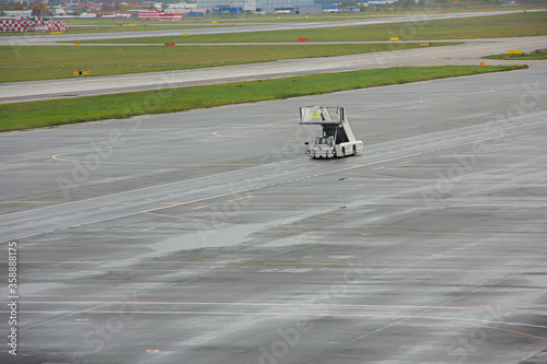 Airport movable ramp. Car ramps driving across the airfield © yos_moes
