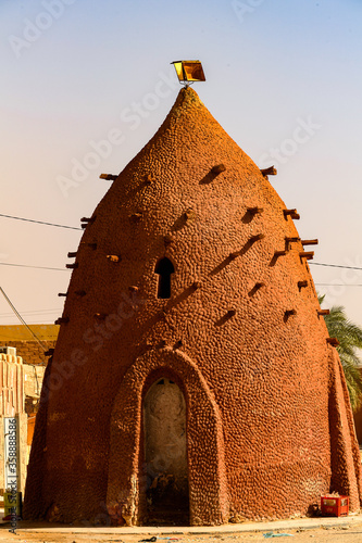 Red architecture of Timimoun, Adrar Province, south-central Algeria photo