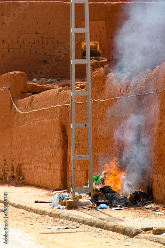 Fire in the street of Timimoun, Adrar Province, south-central Algeria photo