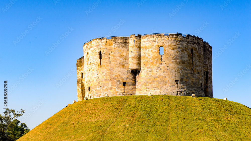 Clifford's Tower in York,  a historic walled city, North Yorkshire, England.