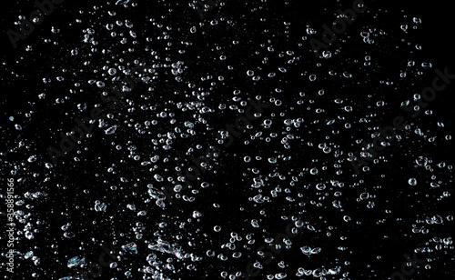 Water bubbles isolate on black background.