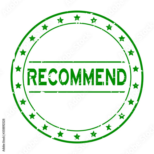 Grunge green recommend word with star icon round rubber seal stamp on white background