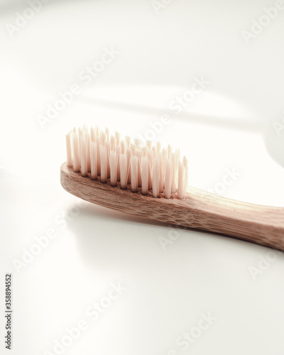 ecological wooden toothbrush on white background