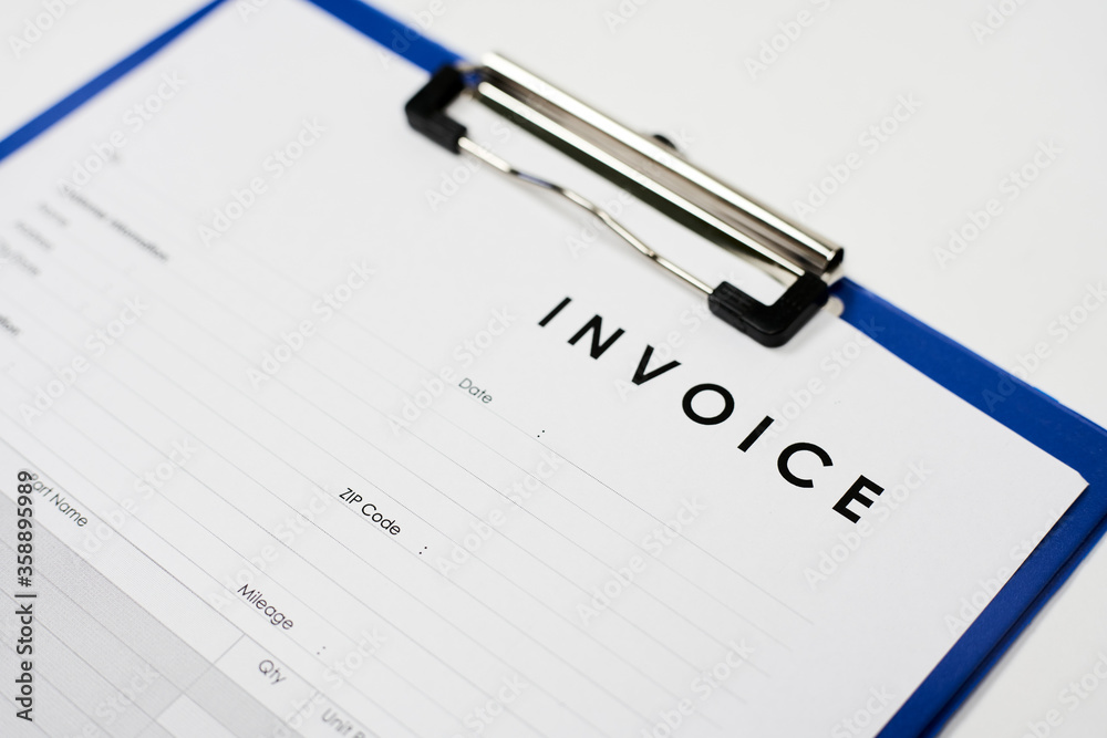 Invoice document on the white background. View from above Invoice document on the white background. View from above