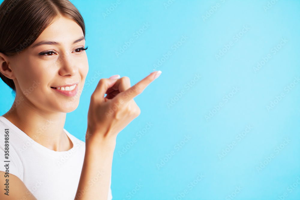 Pretty young woman puts on contact lenses for eyesight Pretty young woman puts on contact lenses for eyesight