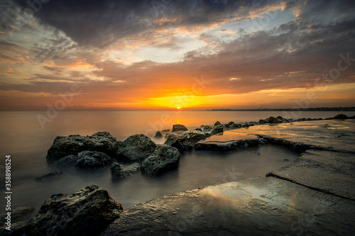 sunset over the sea and rock formation