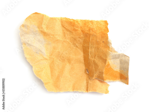 piece of torn brown paper on white background with place for text