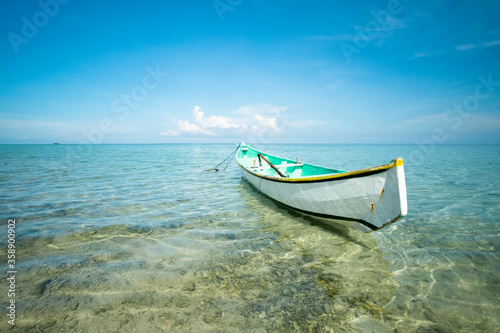 traditional boat in shallow sea water © nurasiyah
