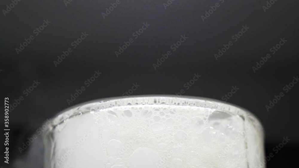 There is white smoke from dry ice covers a glass. There is white smoke from dry ice covers a glass.