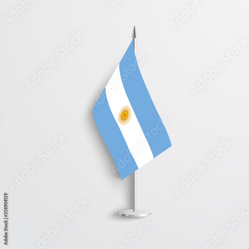 Argentina table flag on light grey background. Argentina desk flag isolated on grey background.