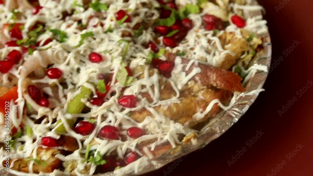 Indian style egg pizza omelette topped with cheese, sauces, garnish and vegetables made on hot oil pan in butter with high flames. Indian style egg pizza omelette topped with cheese, sauces, garnish and vegetables made on hot oil pan in butter with high flames.