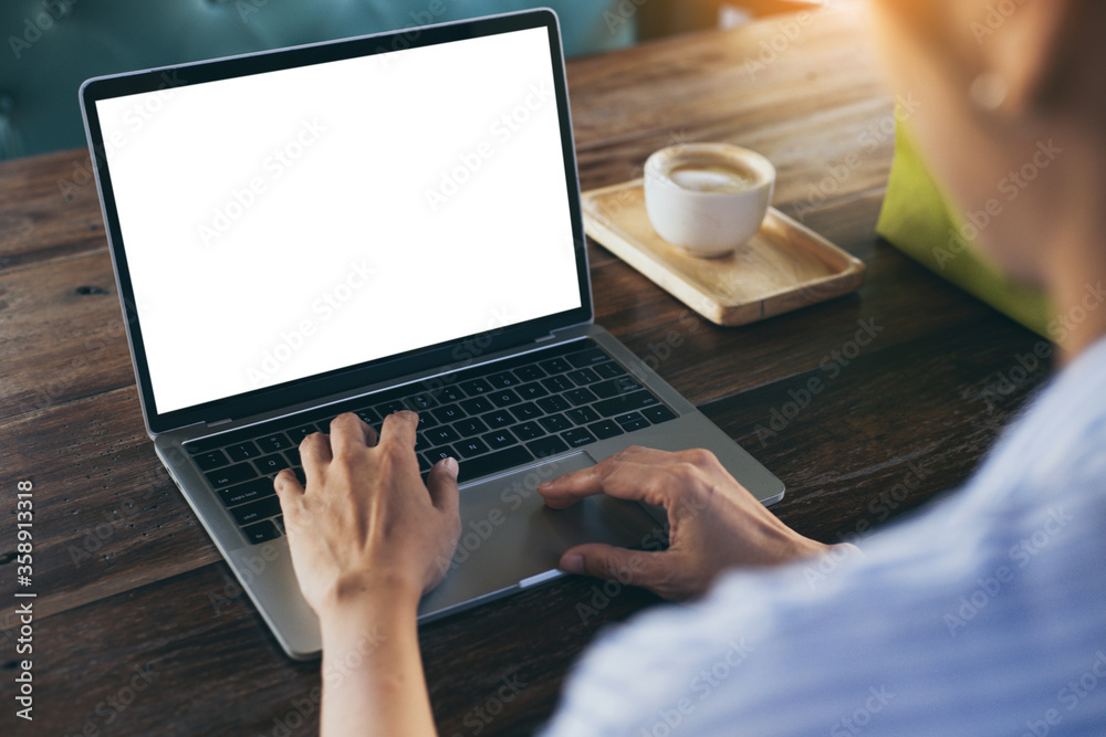 computer mockup image blank screen.hand woman work using laptop with white background for advertising,contact business search information on desk at coffee shop.marketing and creative design computer mockup image blank screen.hand woman work using laptop with white background for advertising,contact business search information on desk at coffee shop.marketing and creative design