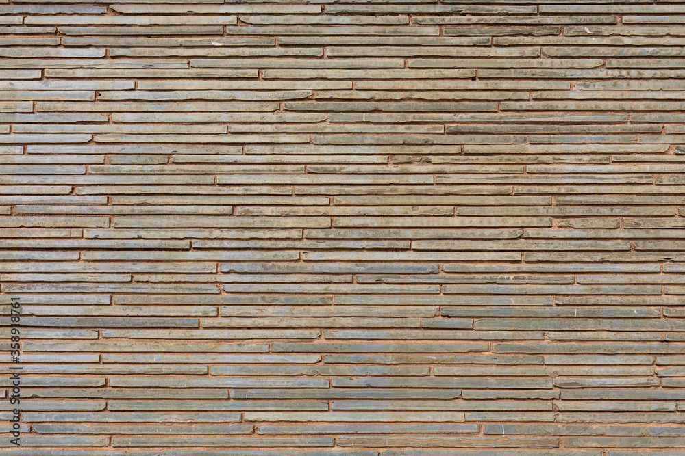 Decorative stone wall in various shades and sober colors, for background use. Decorative stone wall in various shades and sober colors, for background use.