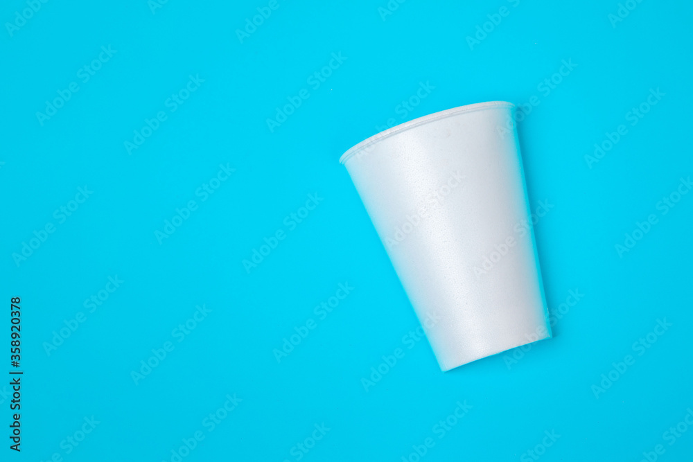 top view paper cup on blue background top view paper cup on blue background