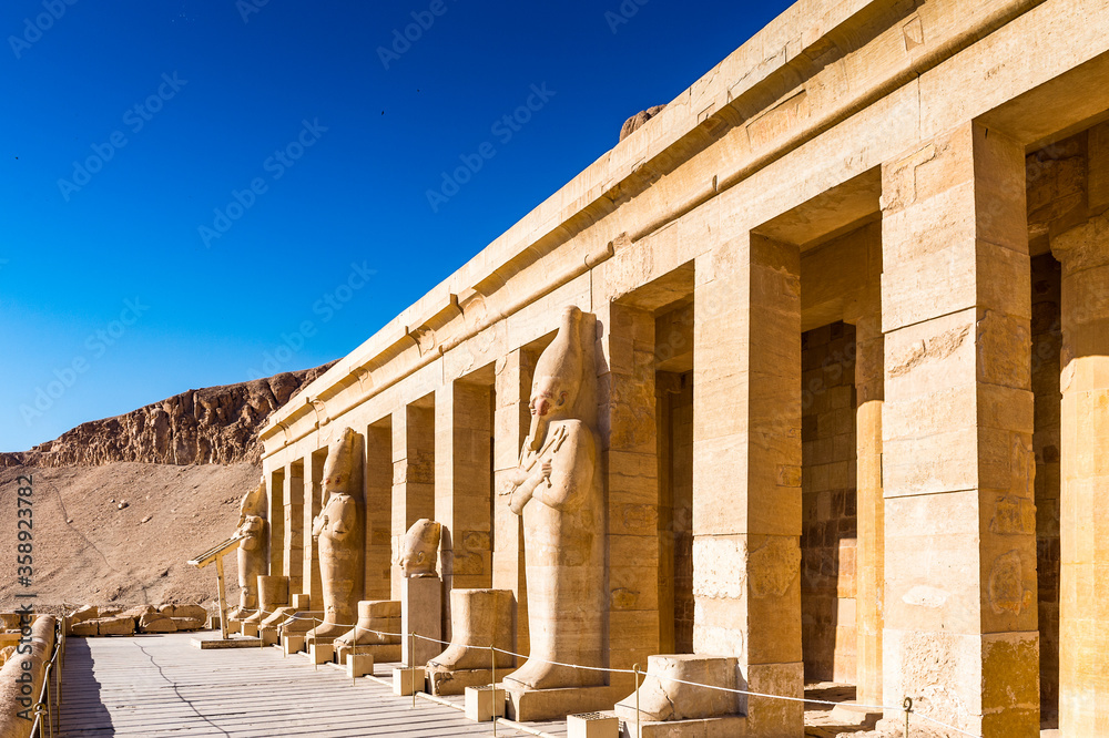 It's Statue of the Queen Hatshepsut's temple (Dayr el-Bahari or Dayr el-Bahri), part of the Theban Necropolis.