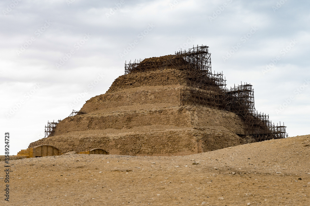 It's Pyramid of Djoser, an archeological remain in the Saqqara necropolis, Egypt. UNESCO World Heritage