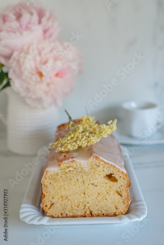 sweet home made elderflower sponge cake on a table