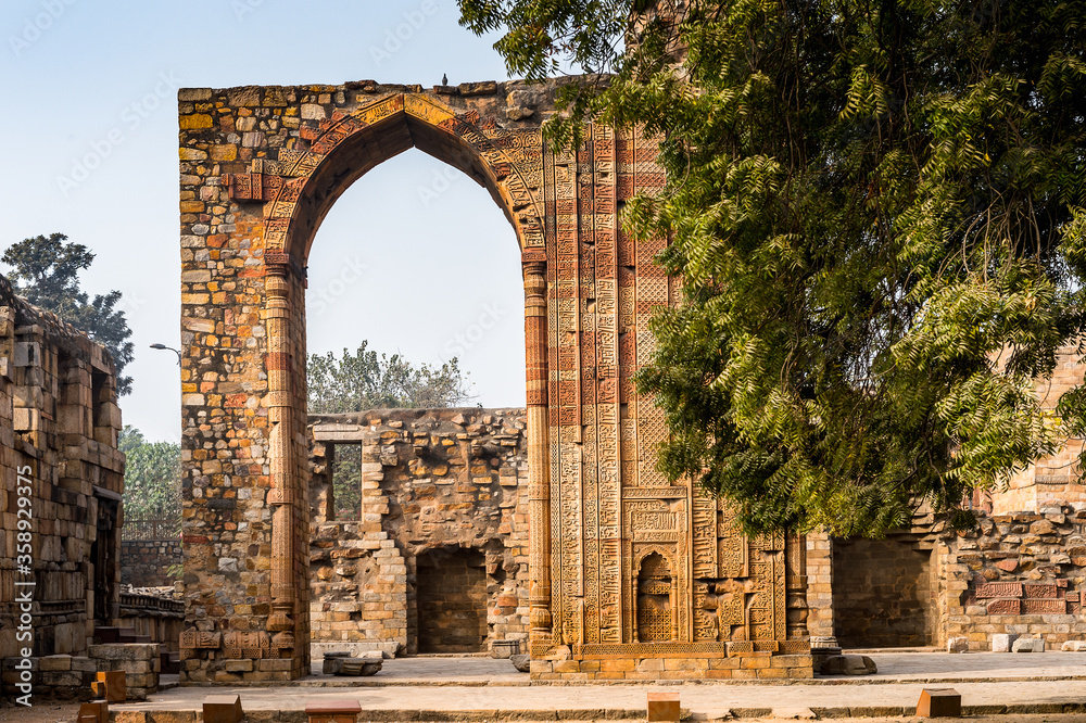 It's Qutb Mosque Arch Ruin at the Qutb complex (Qutub), an array of monuments and buildings at Mehrauli in Delhi, India. UNESCO World Heritage Site