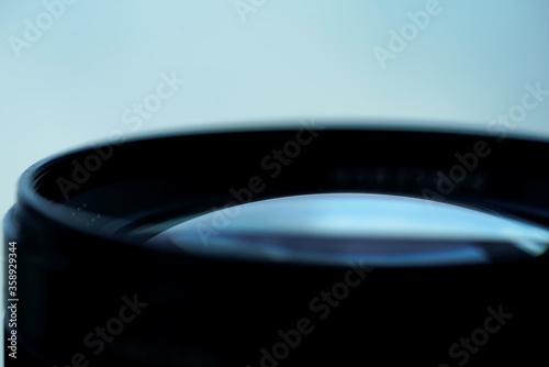 camera lens close up by light background