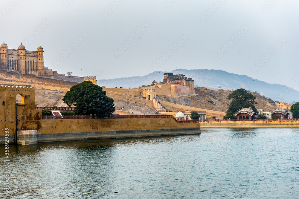It's View of the Amer Fort (Amber Fort and Amber Palace) and the lake Jaipur, Rajasthan state, India. UNESCO World Heritage Site as part of the group Hill Forts of Rajasthan.
