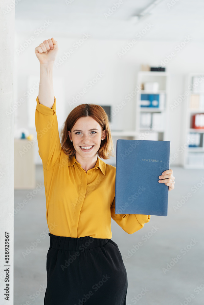 Excited young businesswoman cheering - obrazy, fototapety, plakaty 