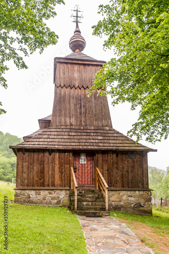 View at the Wooden Church of  Saint Michael Archangel in village Prikra, Slovakia photo