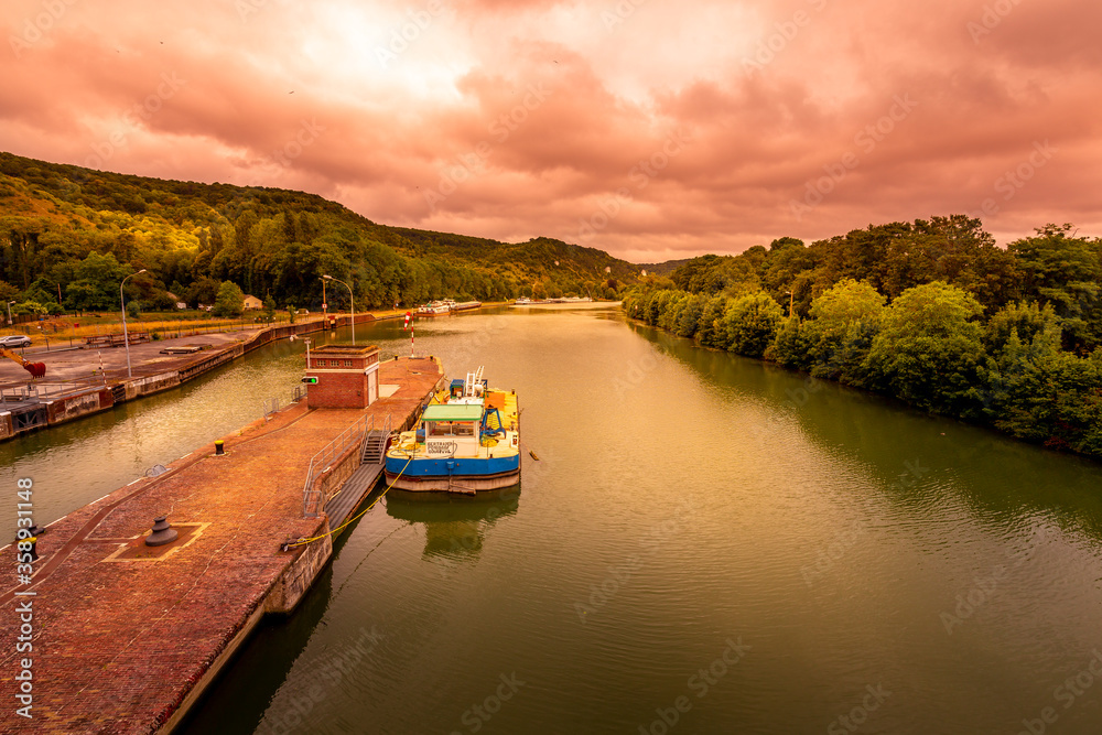 Large view by wide angle on Seine River in France, with canal boats on the river, parked.