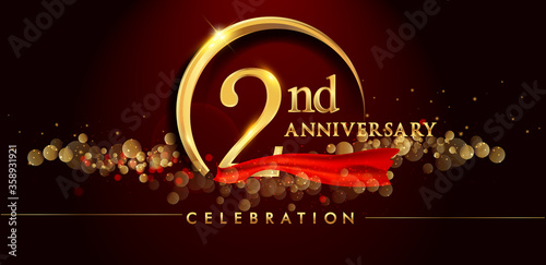 2nd anniversary logo with golden ring, confetti and red ribbon isolated on elegant black background, sparkle, vector design for greeting card and invitation card
