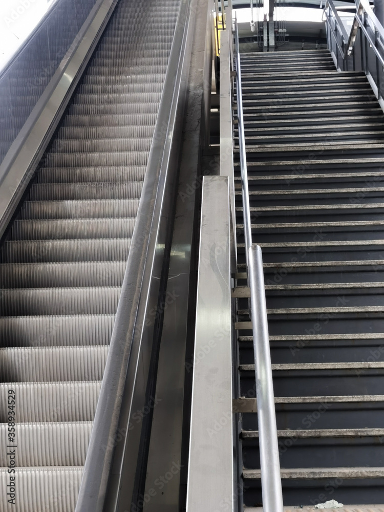 Architecture construction of elevator, escalator stairs and sky walk way, walk bridge between sky train station and department store mall Architecture construction of elevator, escalator stairs and sky walk way, walk bridge between sky train station and department store mall