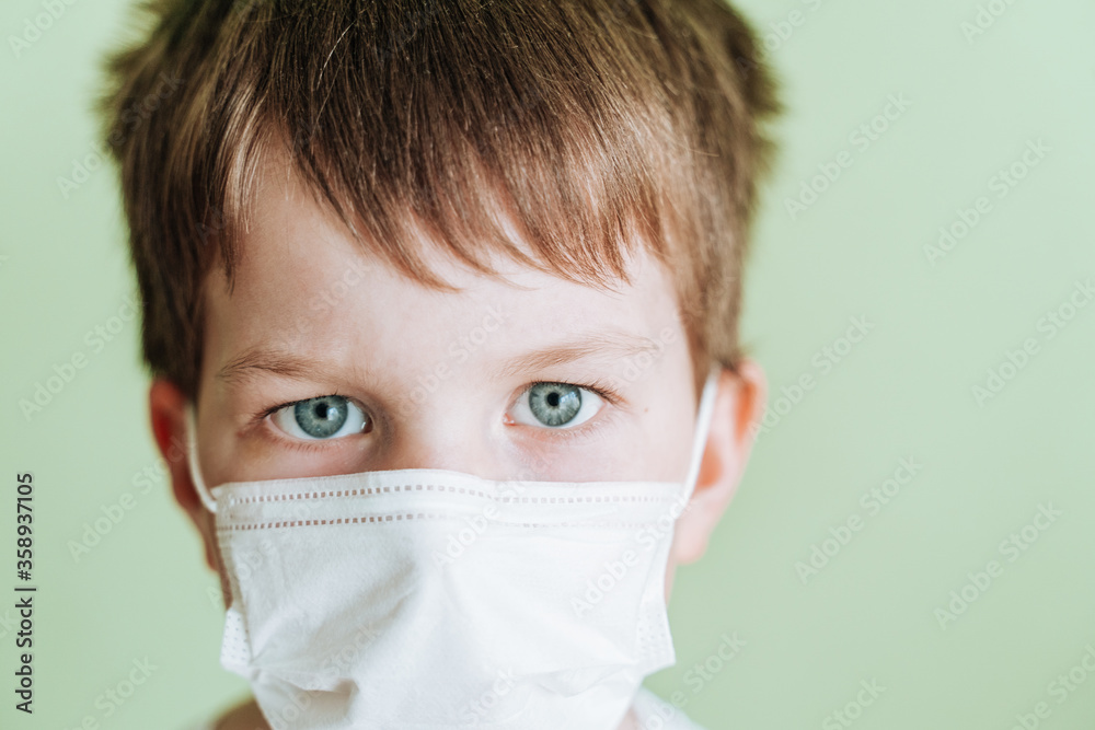 young boy with mask