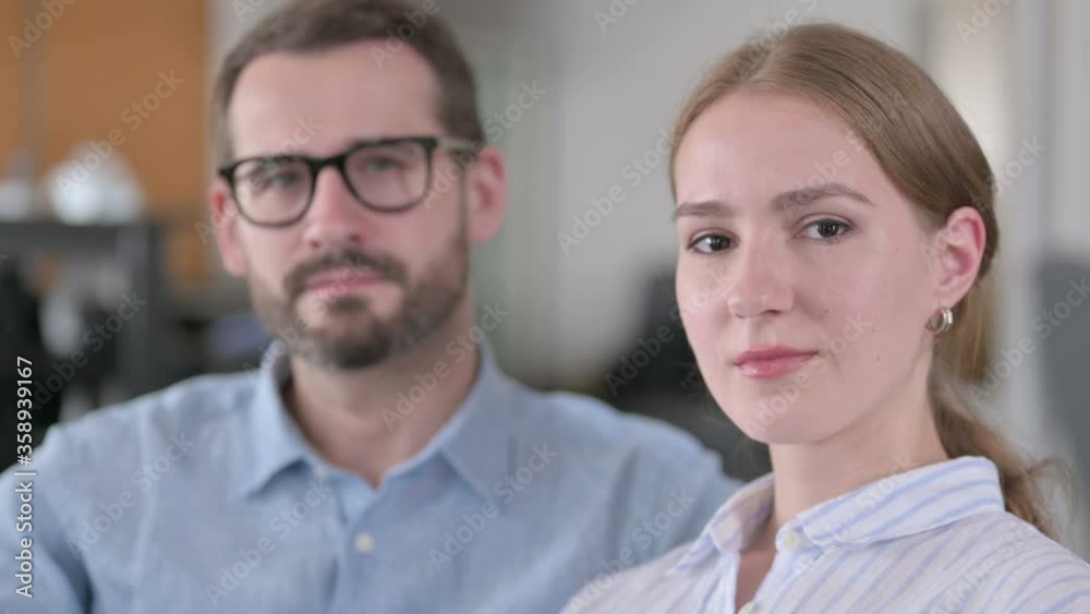 Close up of Serious Young Couple Looking at the Camera Close up of Serious Young Couple Looking at the Camera