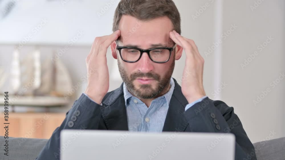 Close Up of Young Businessman with Laptop having Headache Close Up of Young Businessman with Laptop having Headache