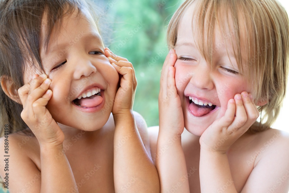 Kids laughing and making funny faces. Happy people. Stock Adobe Stock