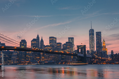 Brooklyn Bridge and Manhattan Skyline at sunset © Zimu
