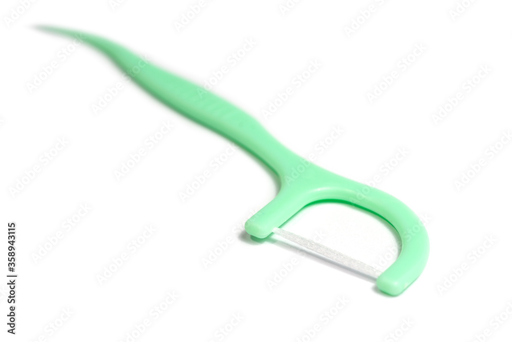 New toothpick and dental floss isolated on white background. New toothpick and dental floss isolated on white background.