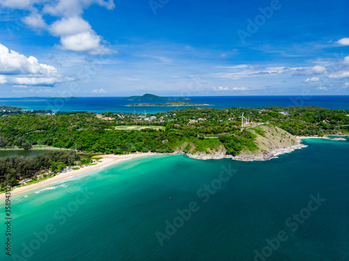 Aerial view from drone of popular tourist attraction, Naiharn beach at Phuket Thailand. Quiet beautiful sandy beach and blue sea.