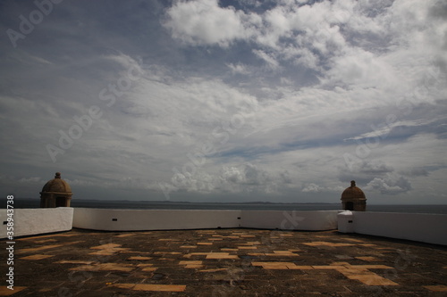 View of historic architecture of farol da barra with sea in Salvador Bahia  Brazil