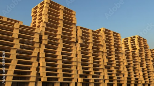 Many wooden palettes for industrial warehouse, looping 3d animation photo